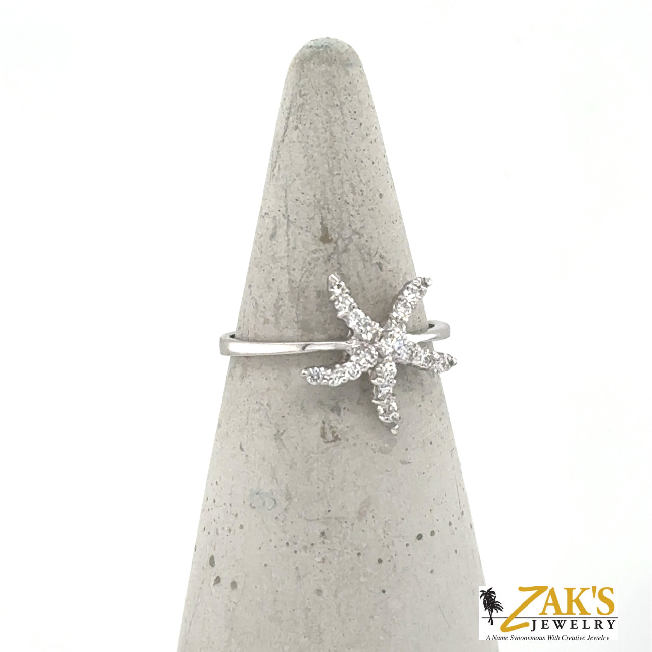 14K white gold ring with diamond pavé starfish on a slender band.