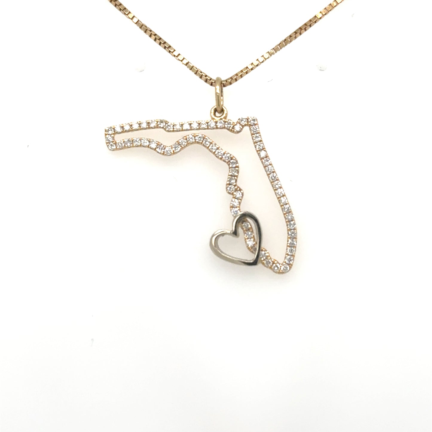 Diamond-outlined Florida pendant in yellow gold with a contrasting white gold heart.