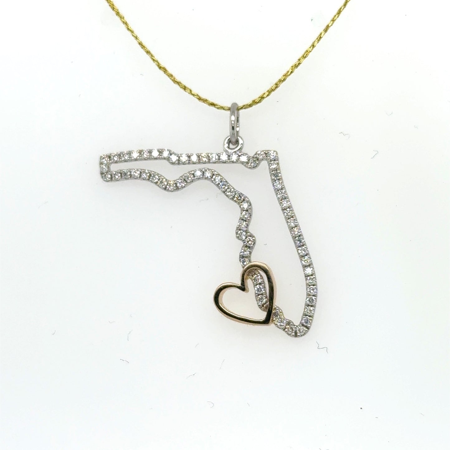 Diamond-outlined Florida pendant in white gold with a small rose gold heart.