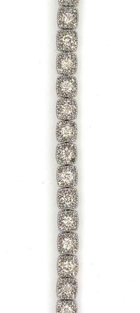 14K white gold tennis bracelet with cushion-shaped halo diamond links.