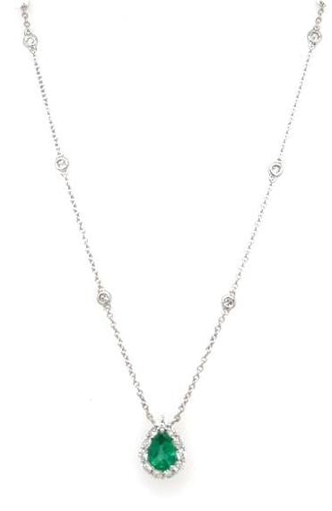 14K white gold necklace with pear emerald halo pendant and bezel-set diamond stations.