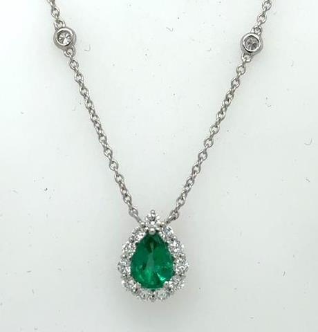 14K white gold necklace with pear-shaped emerald haloed by diamonds on rolo chain.