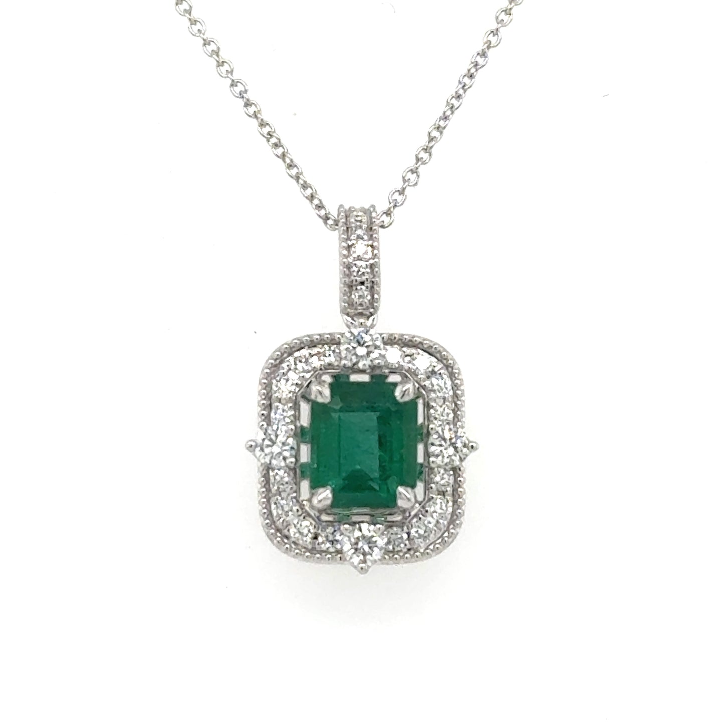 14K white gold pendant with emerald-cut green emerald and diamond halo on chain.