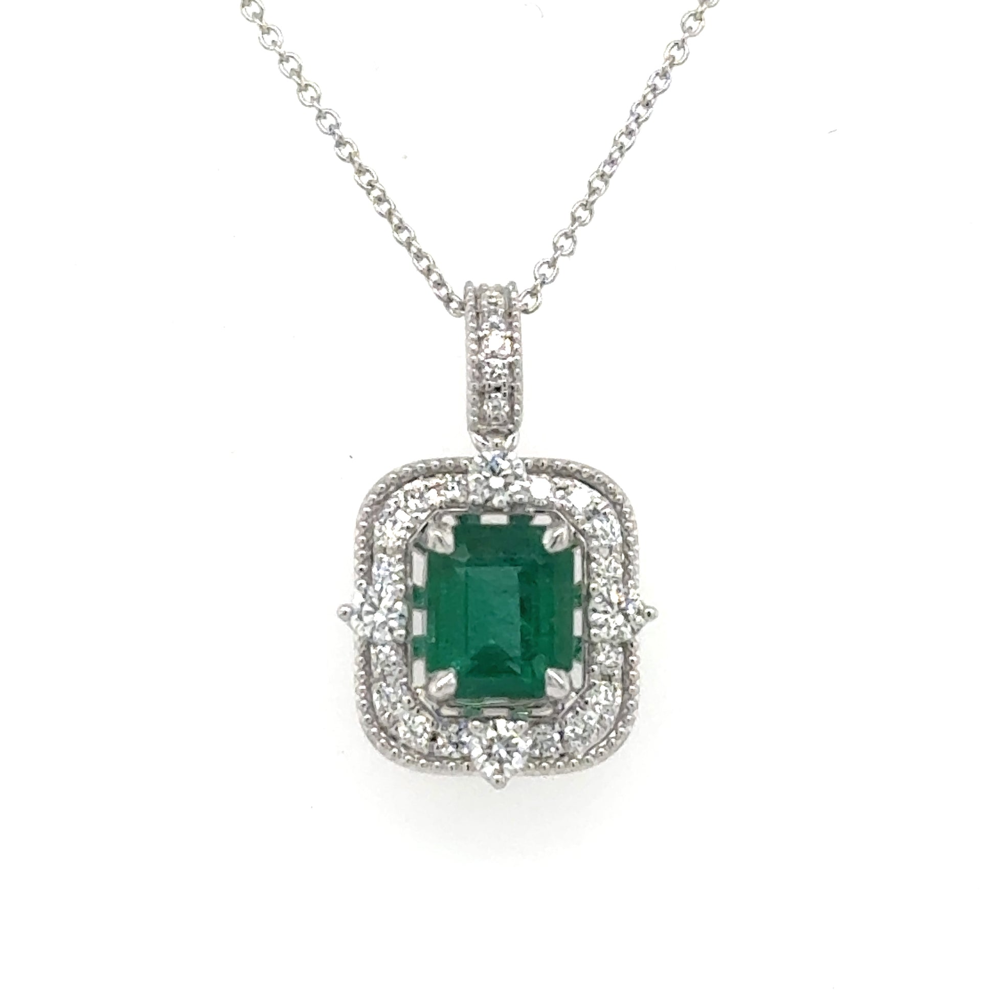 14K white gold pendant with emerald-cut green emerald and diamond halo on chain.
