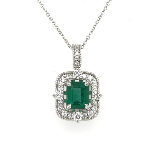 14K white gold pendant with emerald-cut green emerald and diamond halo on chain.