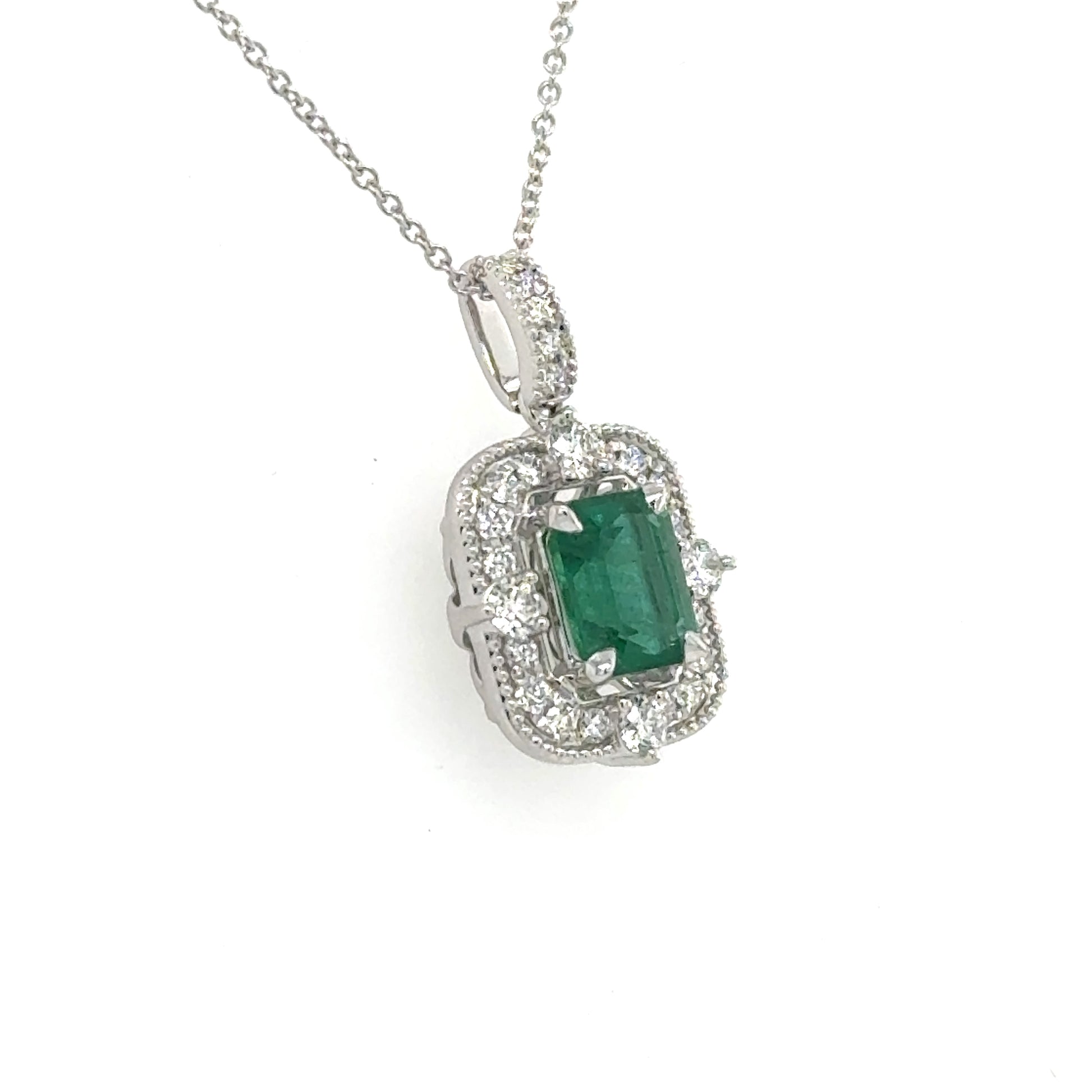 18-inch white gold chain with emerald-cut green emerald pendant and diamond halo.