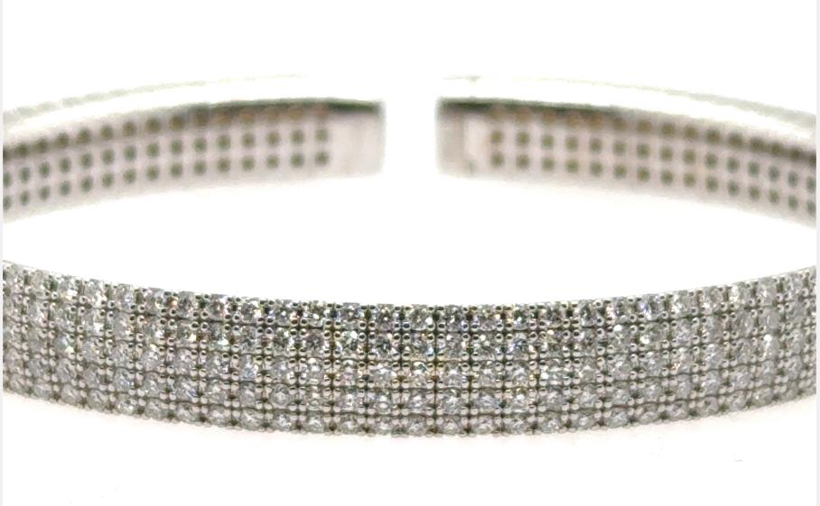 14K white gold open cuff bracelet with five rows of prong-set round diamonds.