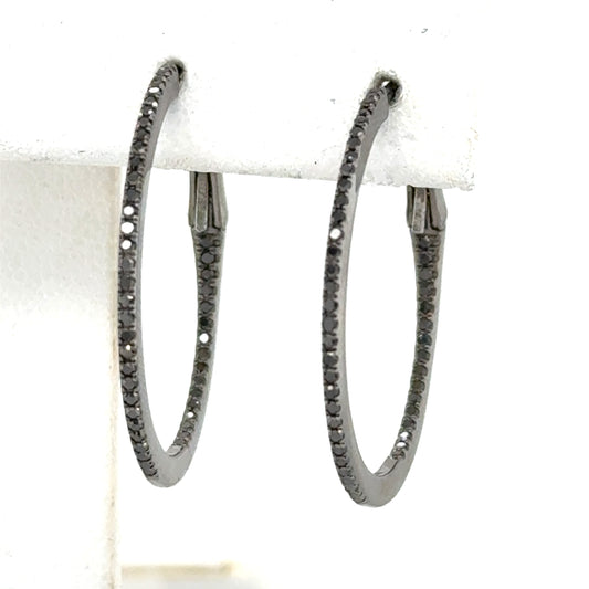 Inside-out hoop earrings in white gold with black rhodium and black diamonds.