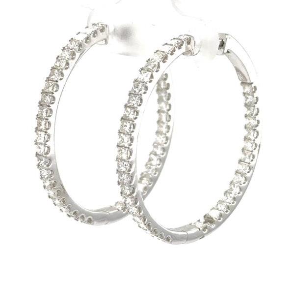 14K white gold inside-out hoop earrings with channel-set princess-cut diamonds.