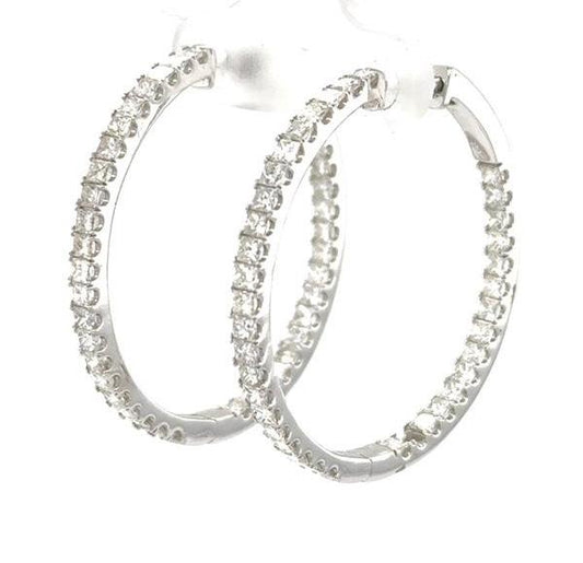 14K white gold inside-out hoop earrings with channel-set princess-cut diamonds.