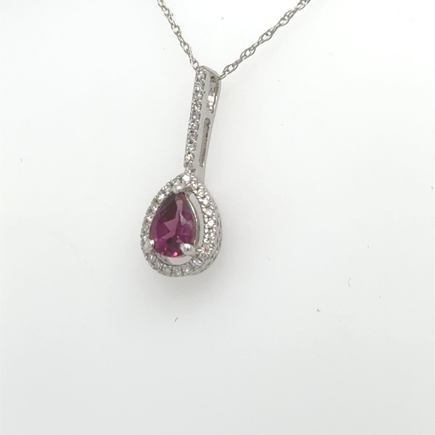 14K white gold pendant with pear-shaped rhodolite garnet and diamond halo.