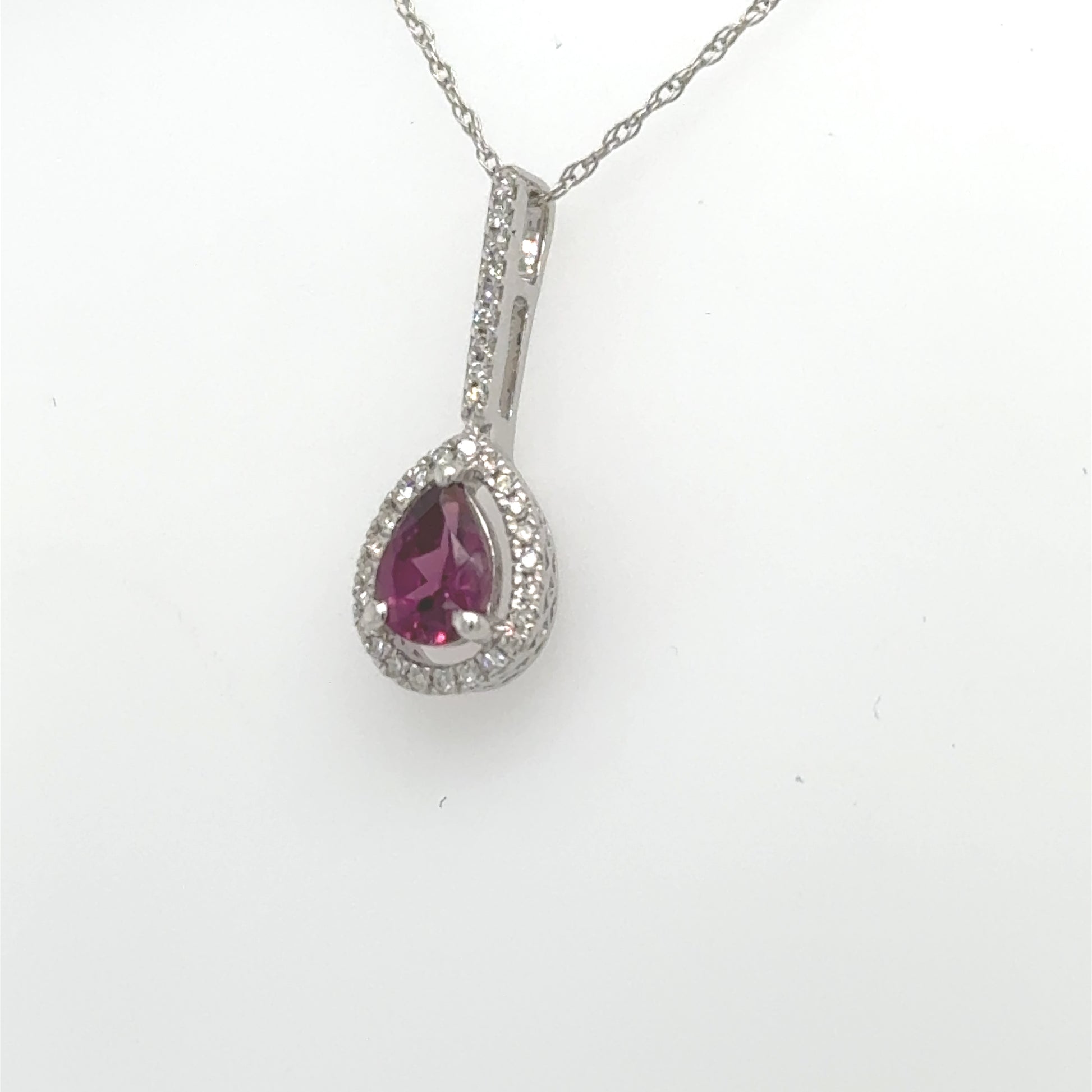 14K white gold pendant with pear-shaped rhodolite garnet and diamond halo.