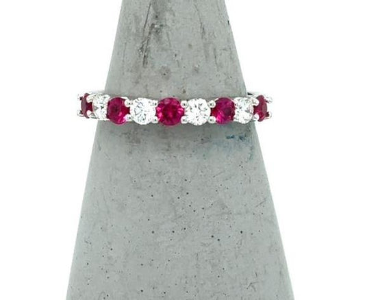 14K white gold band with alternating round rubies and diamonds in shared prongs.