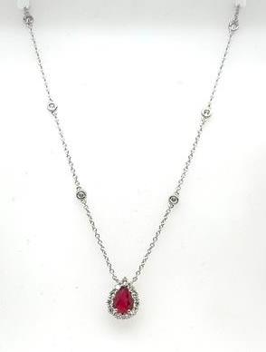 14K white gold necklace with pear-shaped ruby halo pendant and bezel-set station diamonds.