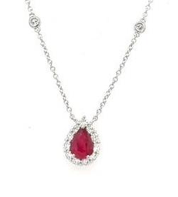 14K white gold necklace with pear-shaped ruby haloed by round diamonds.