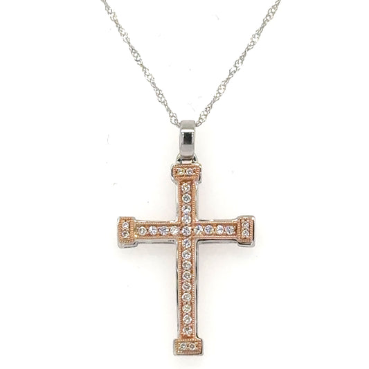 Two-tone white and rose gold diamond cross pendant on twisted rope chain.