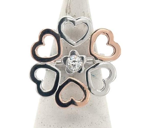 14K white and rose gold open-heart ring with bezel-set round diamond center.