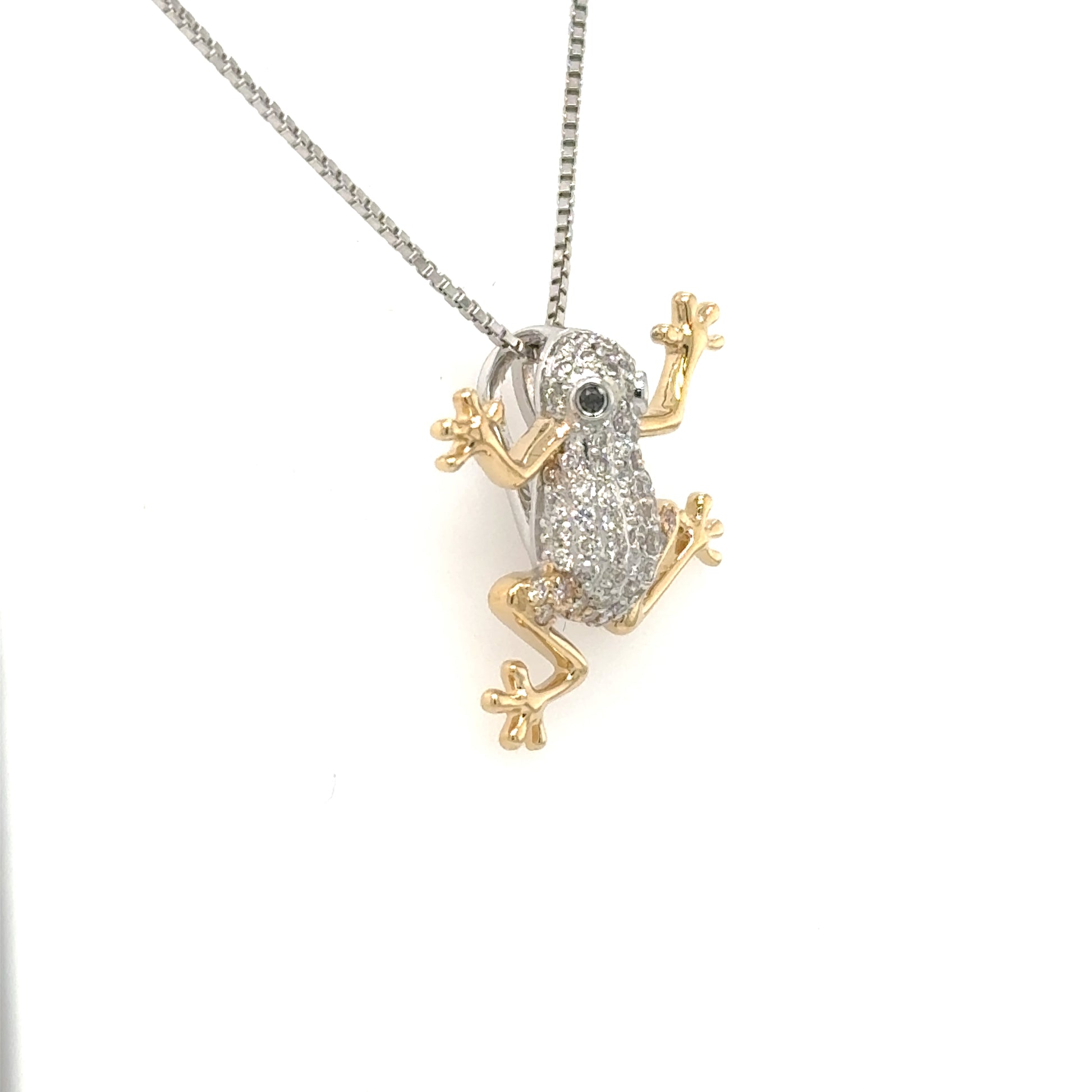 14K white and yellow gold frog pendant, pavé diamond body, blue sapphire eyes.