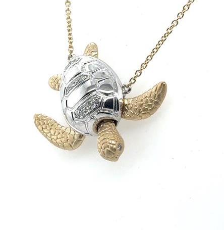 14K yellow and white gold sea turtle pendant with diamond-accented shell on chain.