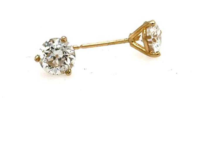 Round diamond stud earrings in 14K yellow gold, three-prong martini settings.