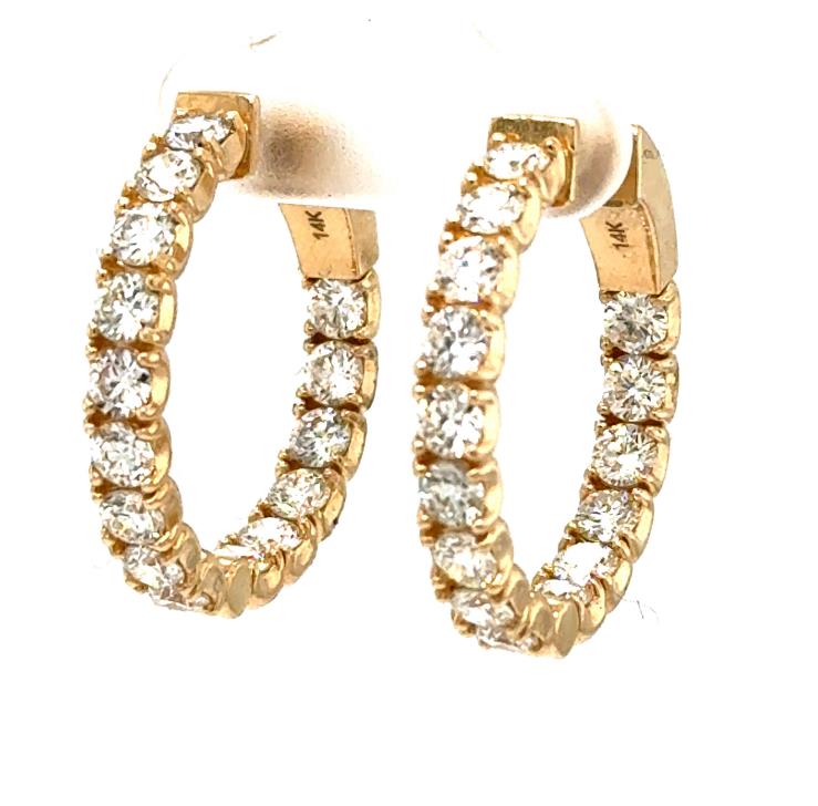 14K yellow gold inside-out hoop earrings with round diamonds in prong settings.
