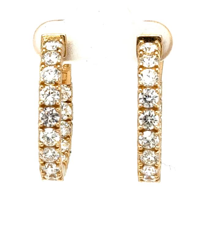 14K yellow gold inside-out hoop earrings with round diamonds in prong settings.