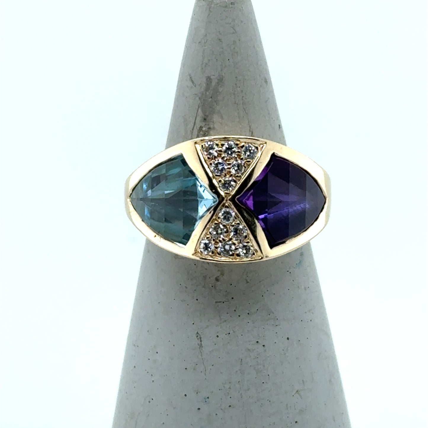 14K yellow gold ring with bezel-set blue topaz, amethyst, and pavé diamonds.