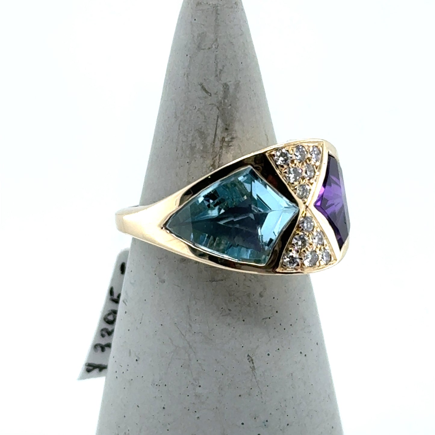 14K yellow gold ring with bezel-set blue topaz, amethyst, and pavé diamonds.