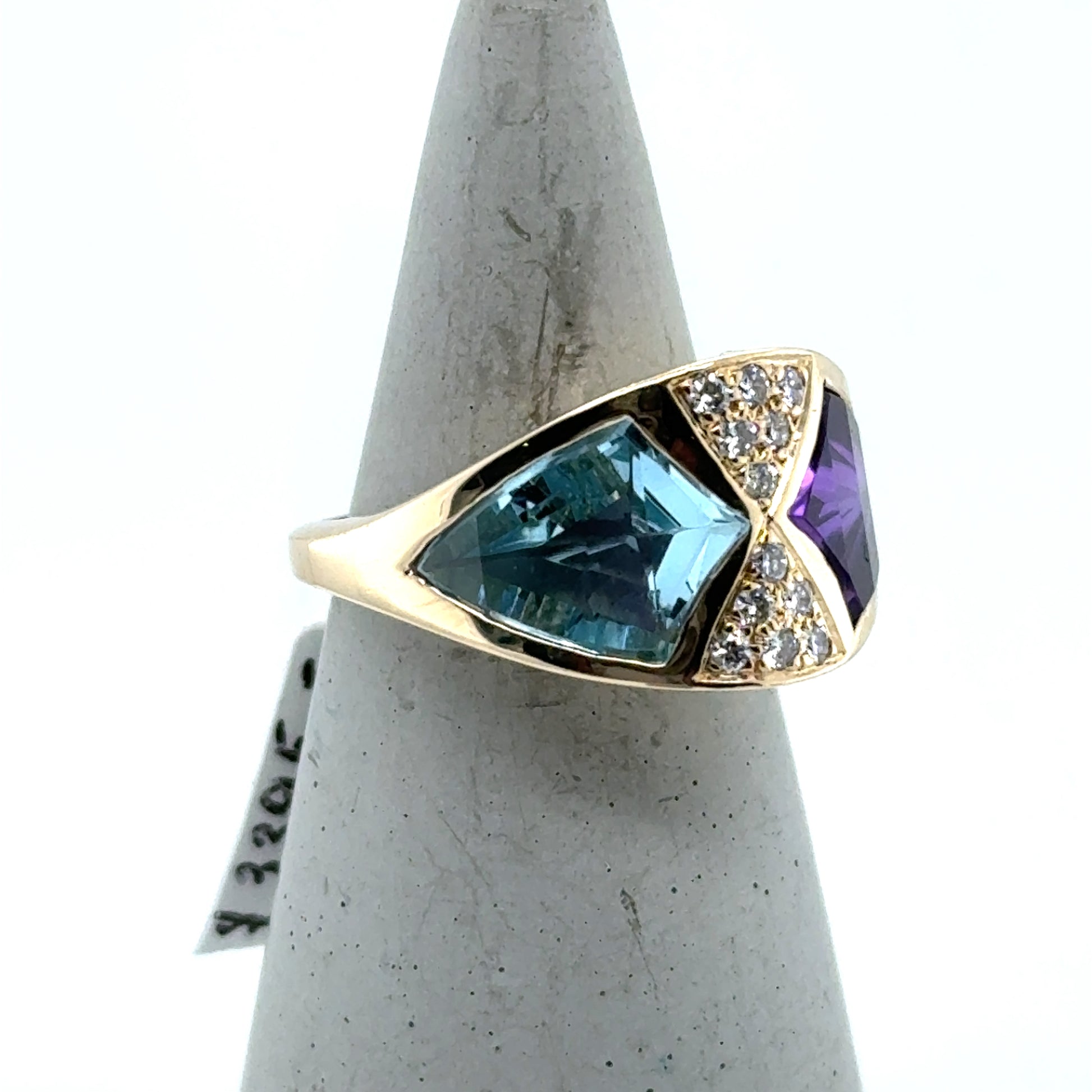 14K yellow gold ring with bezel-set blue topaz, amethyst, and pavé diamonds.