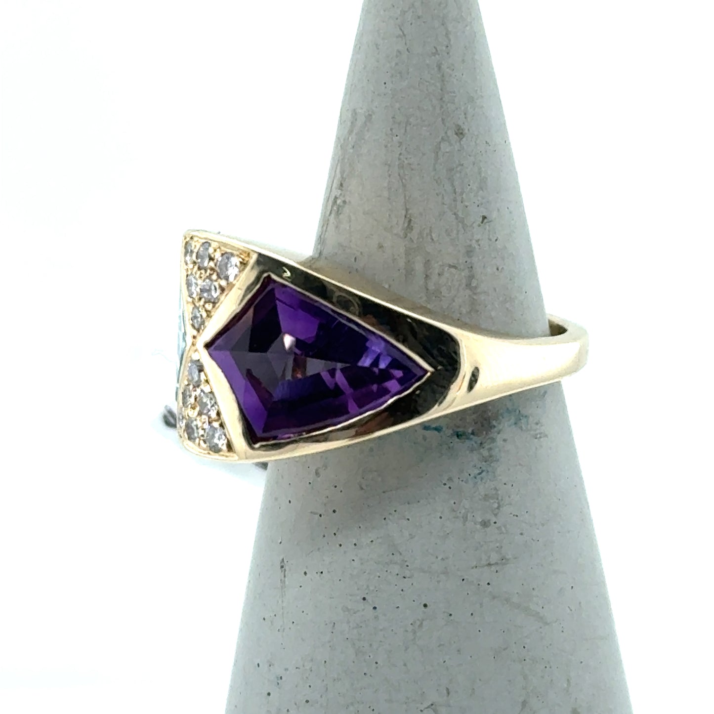14K yellow gold ring with bezel-set purple amethyst and pavé diamond accents.