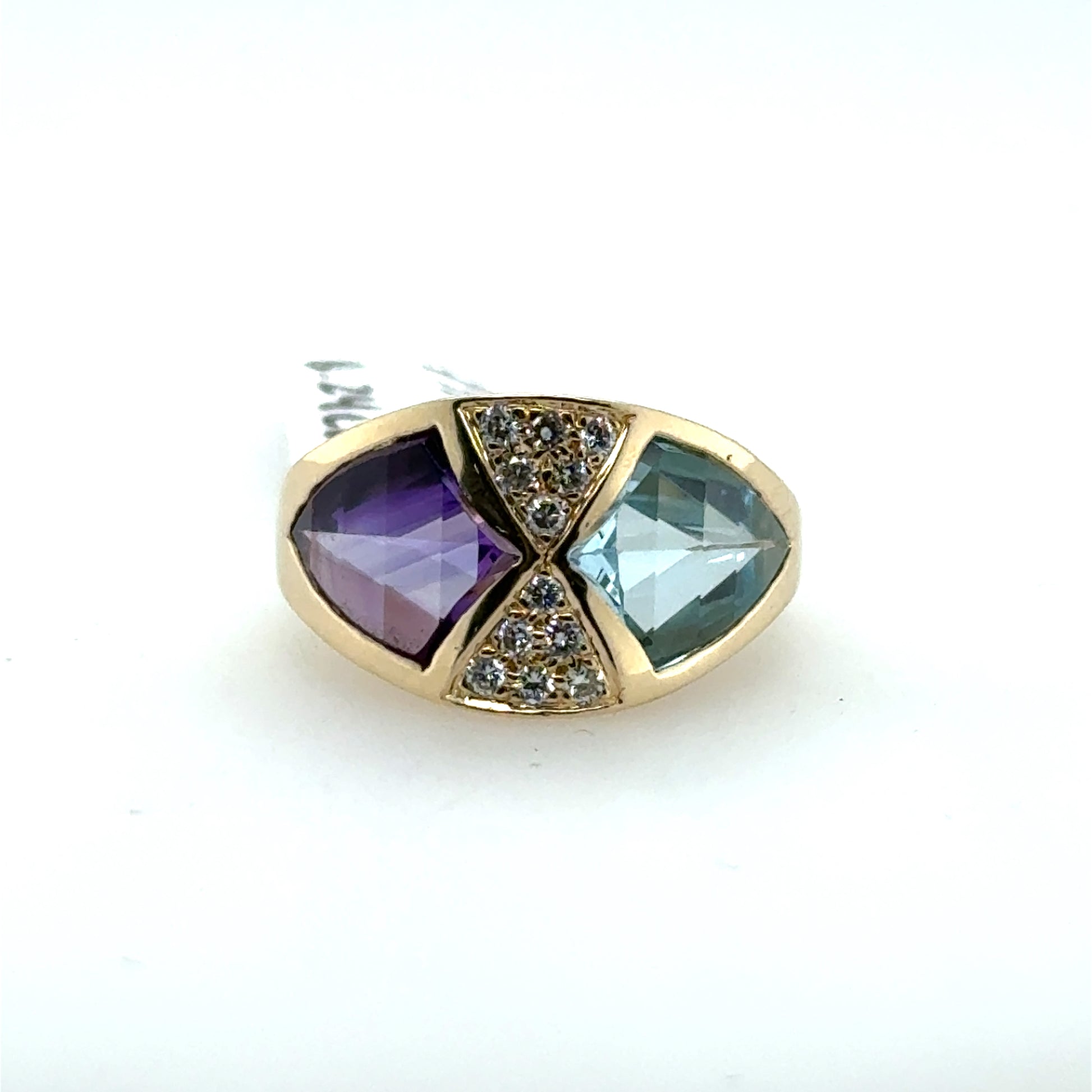 14K yellow gold ring with bezel-set amethyst and blue topaz flanking pavé diamonds.