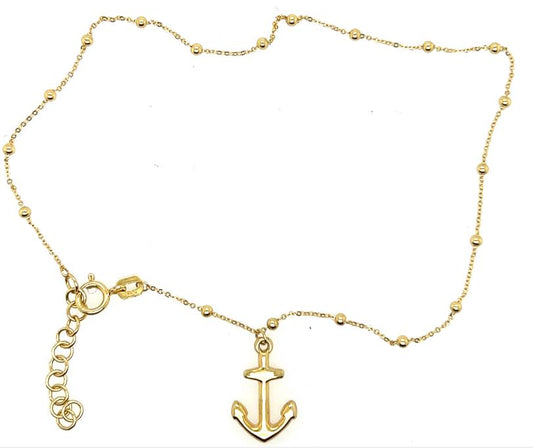 14K yellow gold beaded anklet with anchor charm and extender chain.