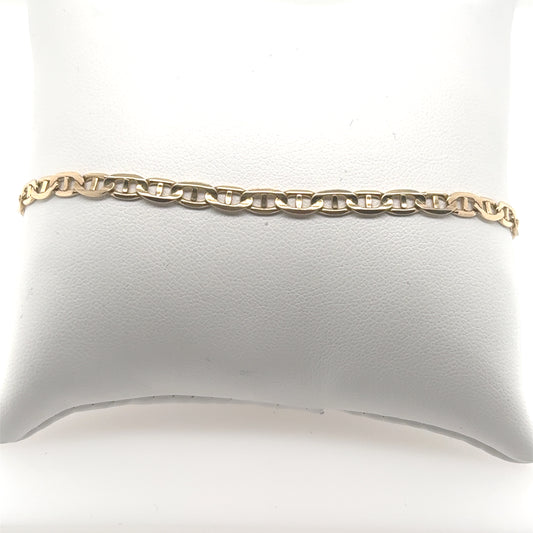 14K yellow gold anchor link bracelet with flat oval links and lobster clasp.