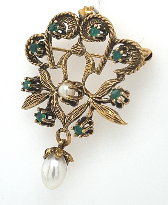 Antique 14K yellow gold floral pin‑pendant with round emeralds and pearl drop.