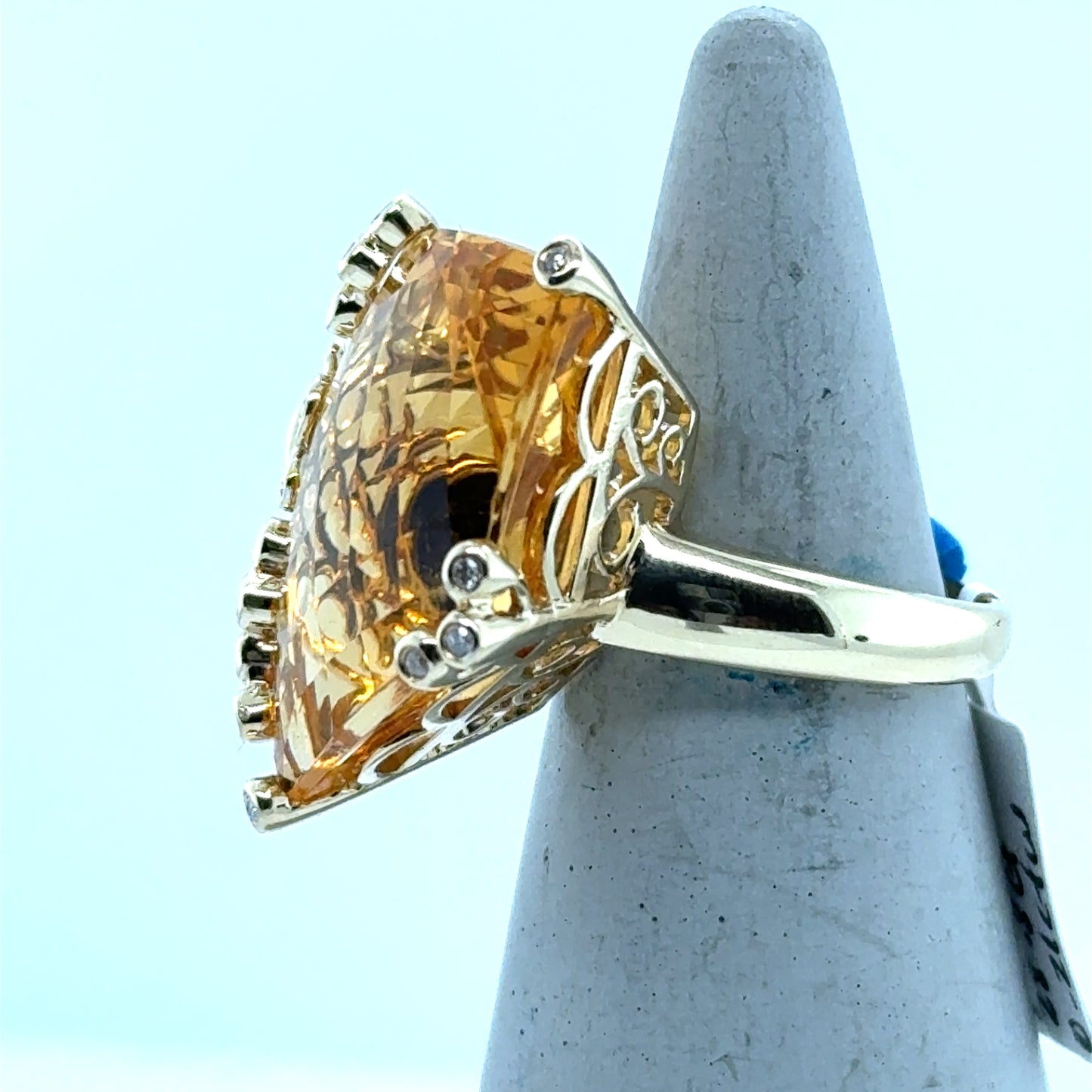 14K yellow gold ring with large fantasy-cut citrine and diamond-accented prongs.