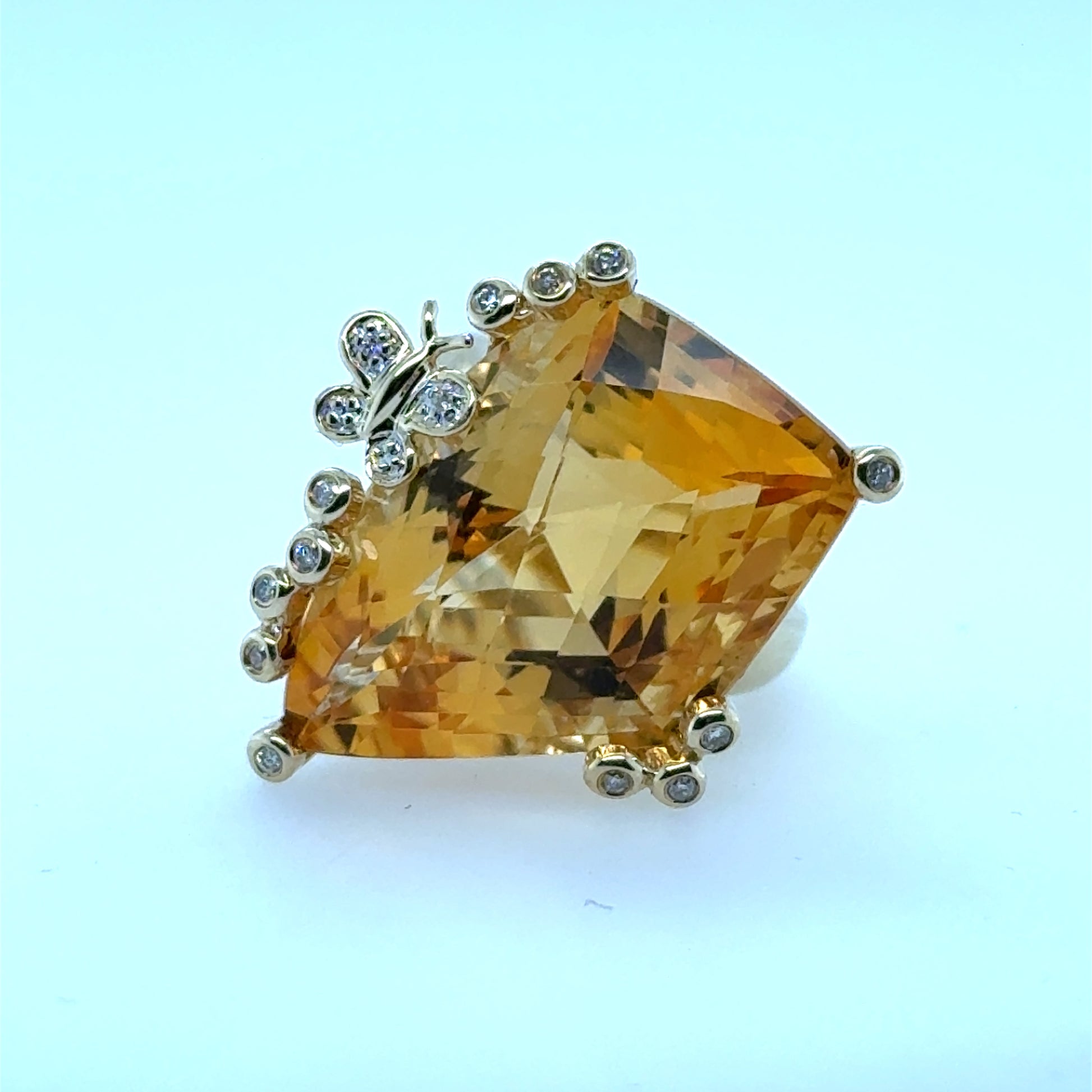 14K yellow gold ring with large fantasy-cut citrine and diamond-accented prongs, including butterfly motif.