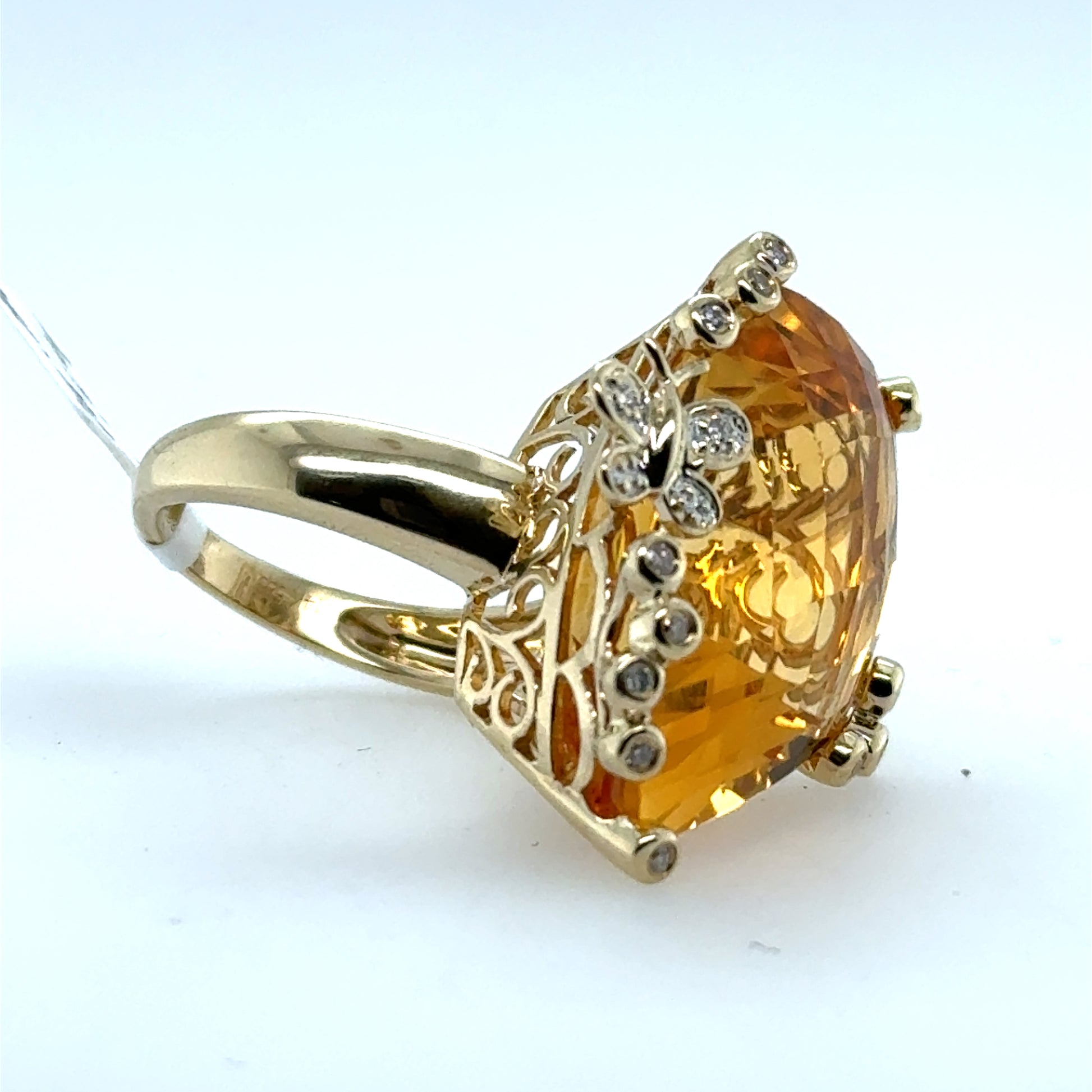 14K yellow gold ring with large fantasy-cut citrine and diamond-accented prongs.