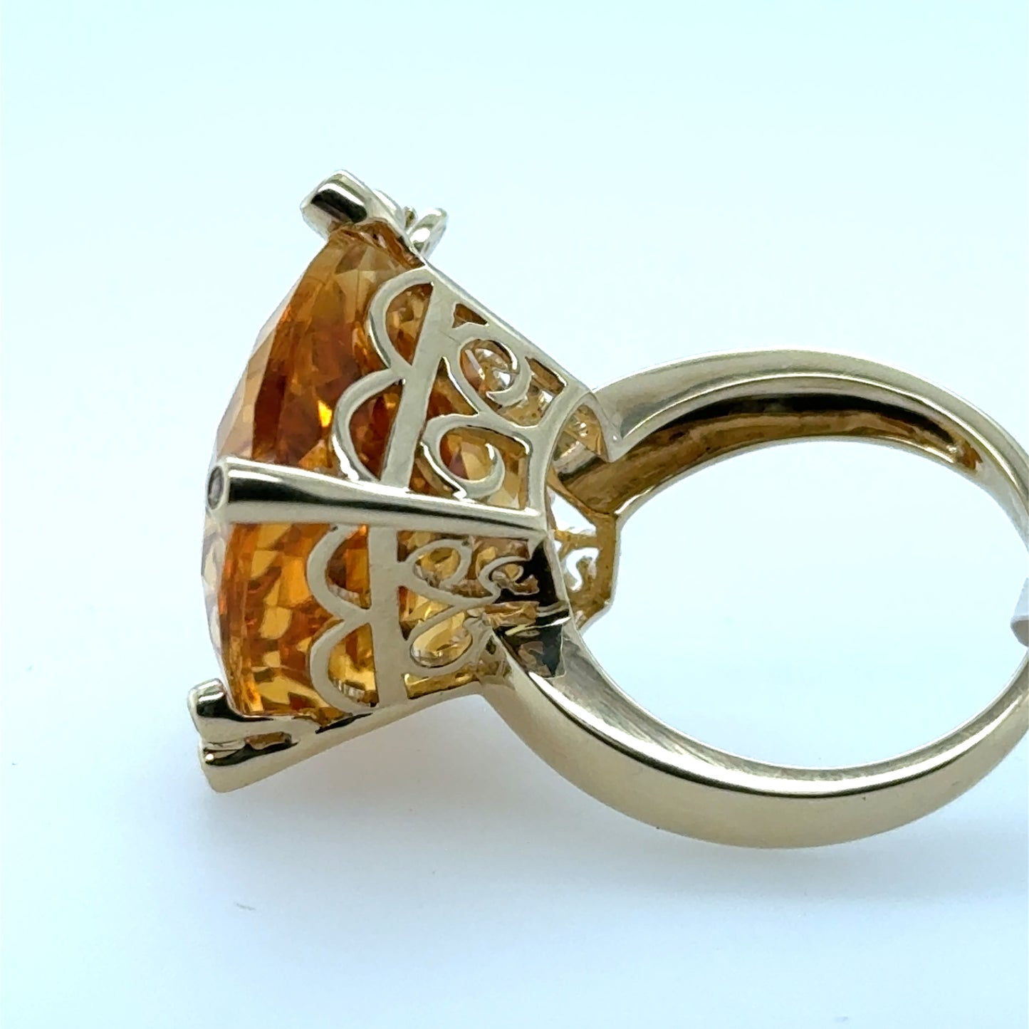 14K yellow gold ring with large faceted citrine and ornate filigree basket.