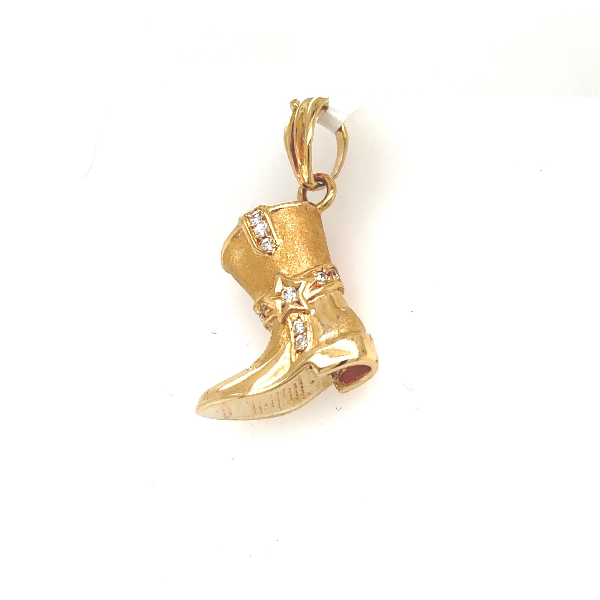 14K yellow gold cowboy boot charm with star accents and clear stones.