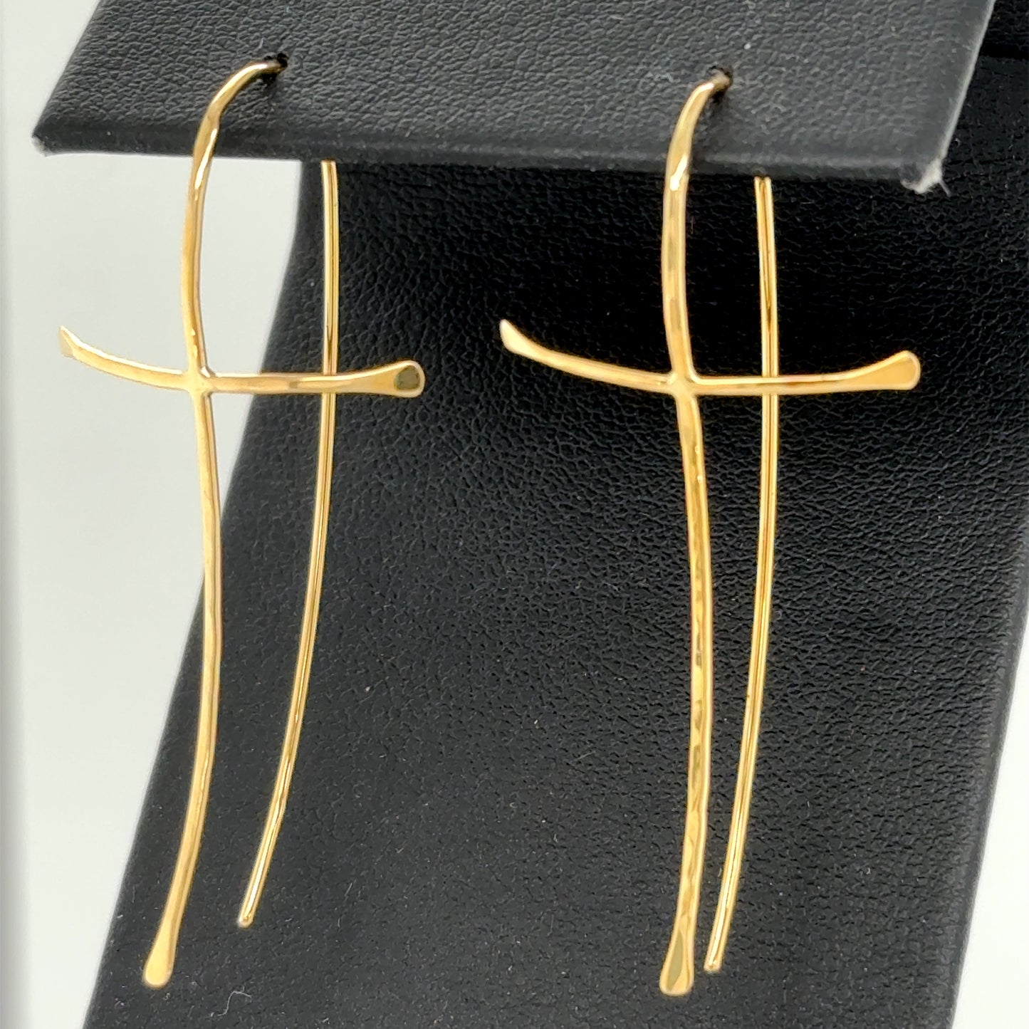 14K yellow gold cross threader earrings with long curved drop wires.