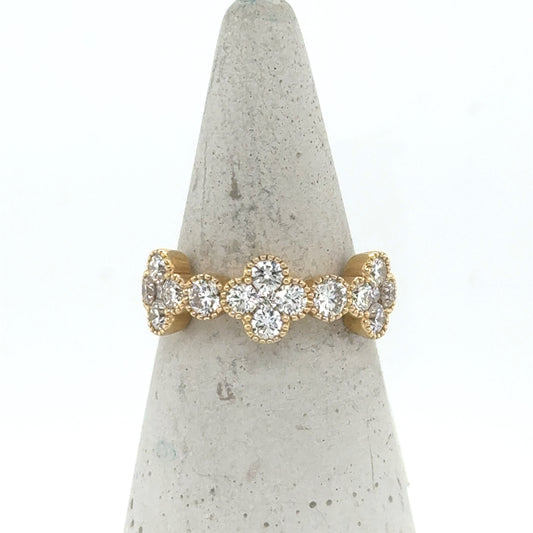14K yellow gold band with diamond clover motifs and round diamond accents.