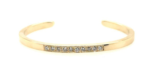 14K yellow gold open cuff bracelet with a front row of round diamonds.
