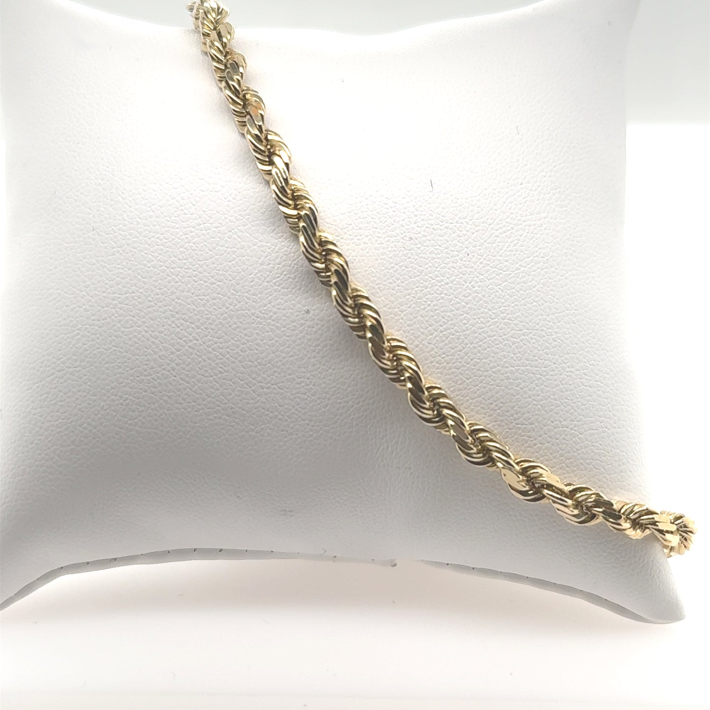14K yellow gold diamond-cut rope bracelet with twisted links and lobster clasp.