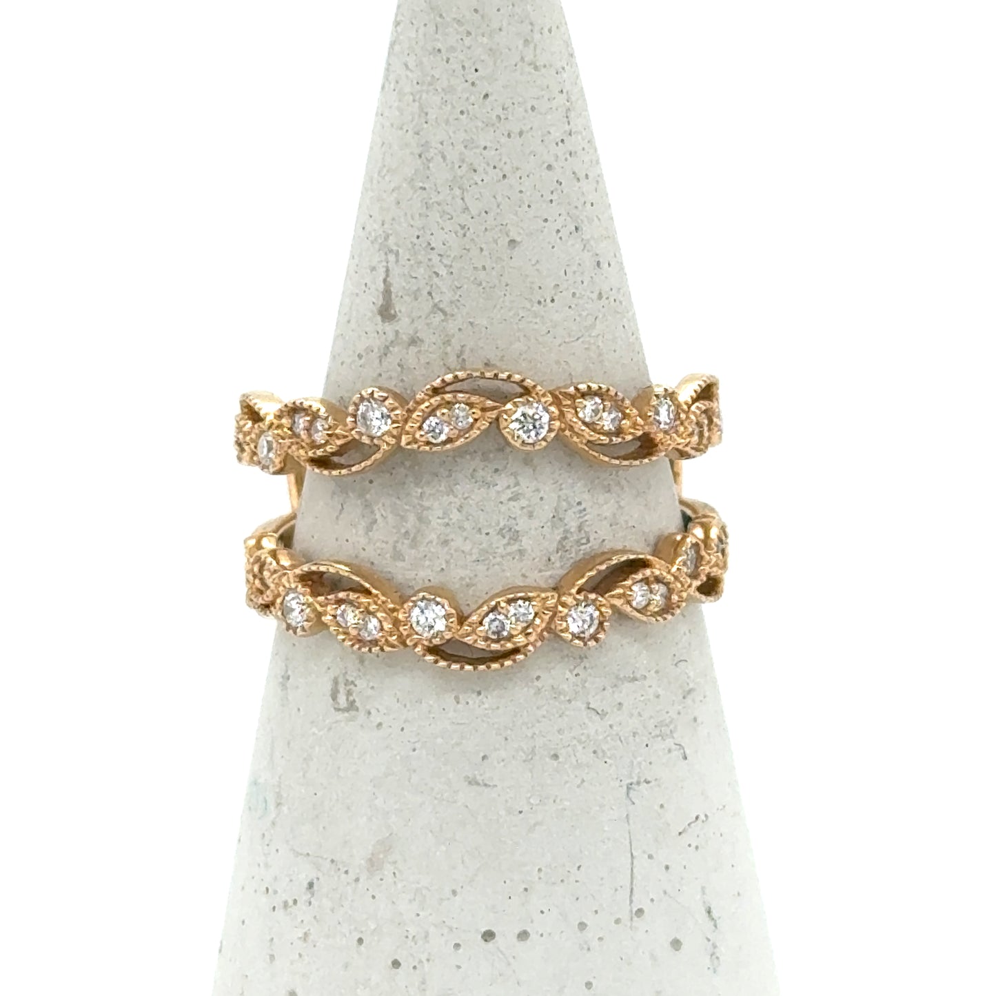 Yellow gold diamond enhancer band with vine motif and milgrain detailing.