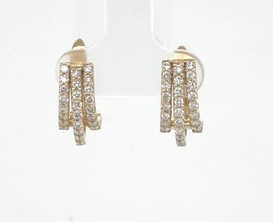 14K yellow gold huggie earrings with triple rows of round diamond pavé.