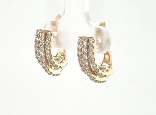 14K yellow gold huggie earrings with triple rows of round diamonds.