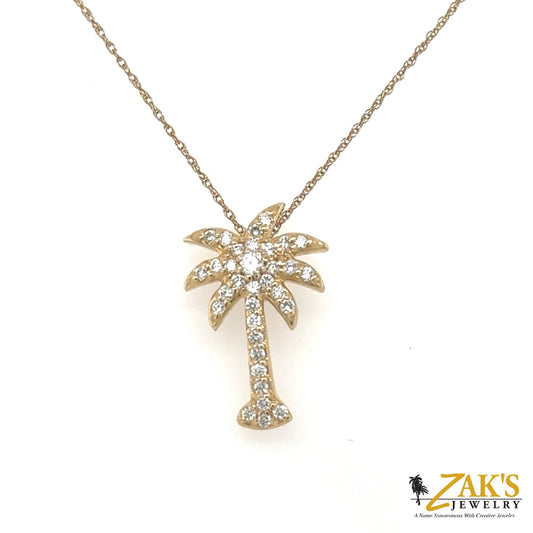 Yellow gold palm tree pendant pave-set with round diamonds on a fine chain.