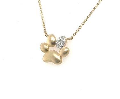 14K yellow gold paw print pendant with diamond accent on cable chain.