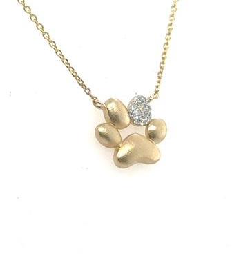 14K yellow gold paw print pendant with diamond-accent toe on cable chain.