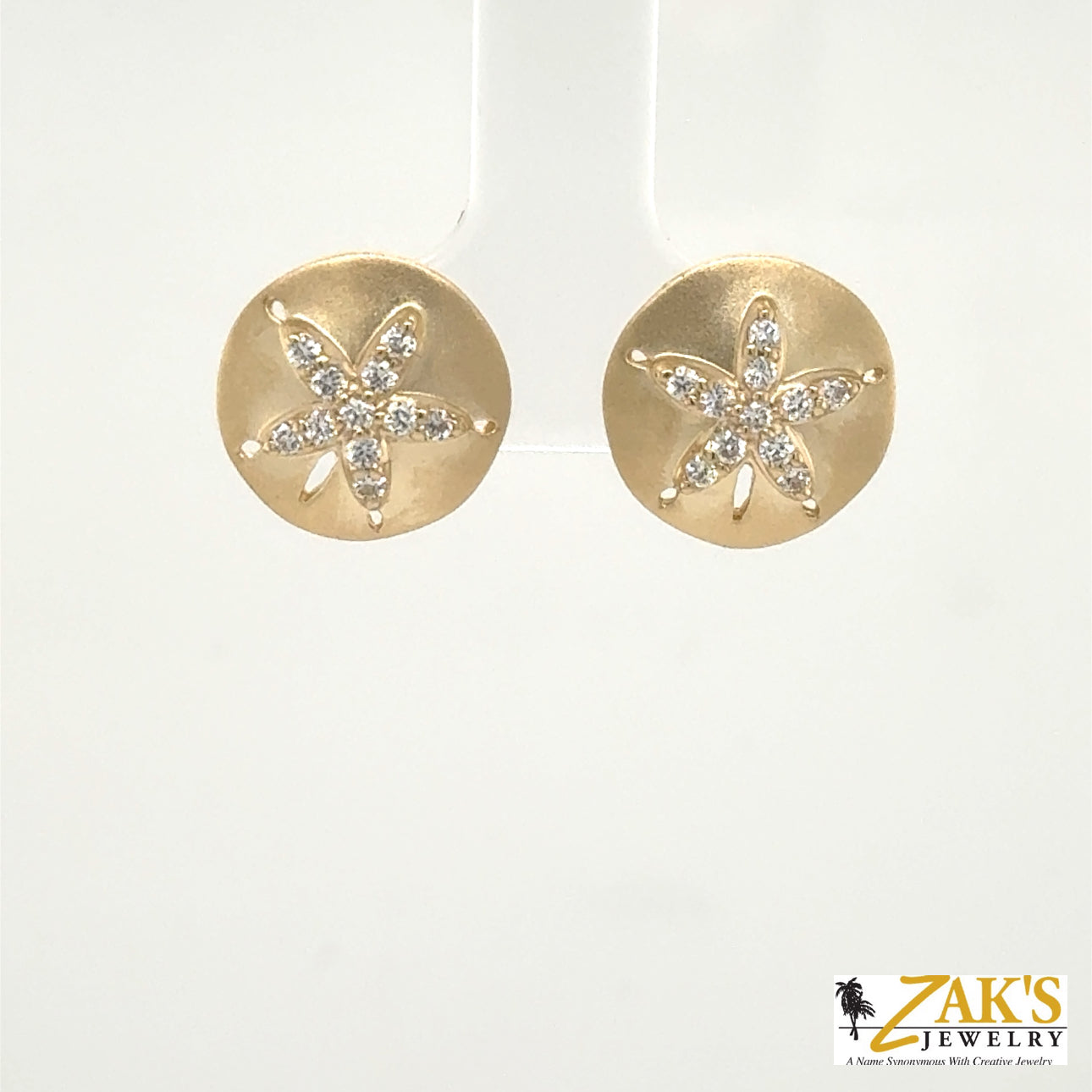 14K yellow gold sand dollar stud earrings with diamond-accented star motif.
